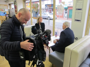 Cameraman films interview in Coffee Junction