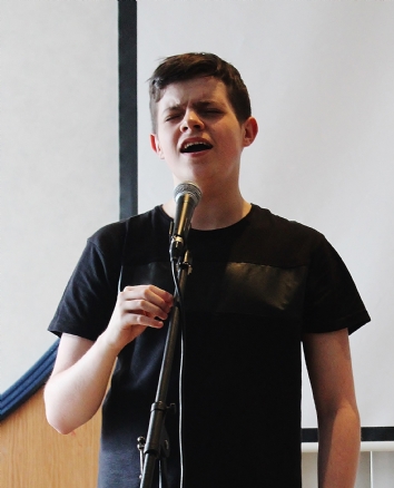 Performing Arts student Bradley singing
