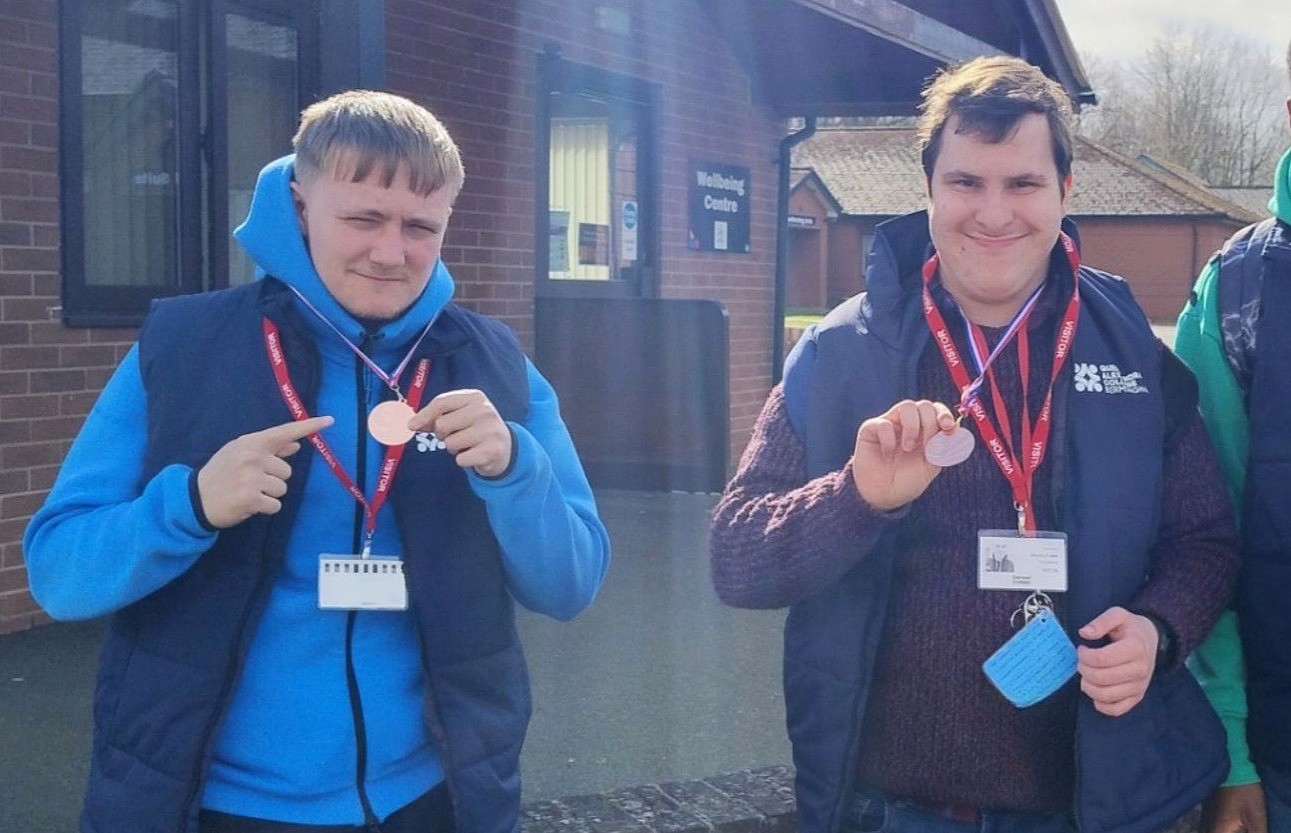 Image of Bobby and Bayley wearing their medals