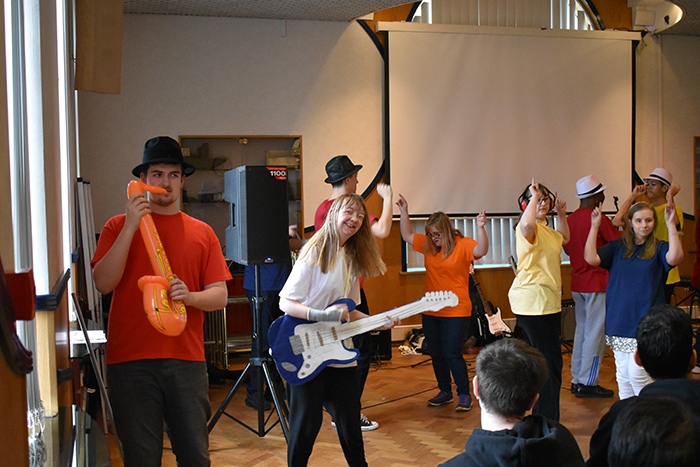 Students signing and dancing during the Student Showcase event