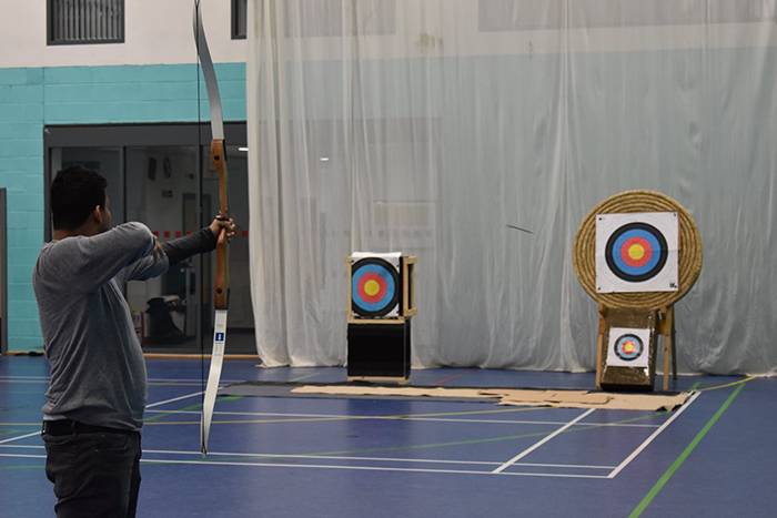 QAC student takes part in archery session in the sports hall