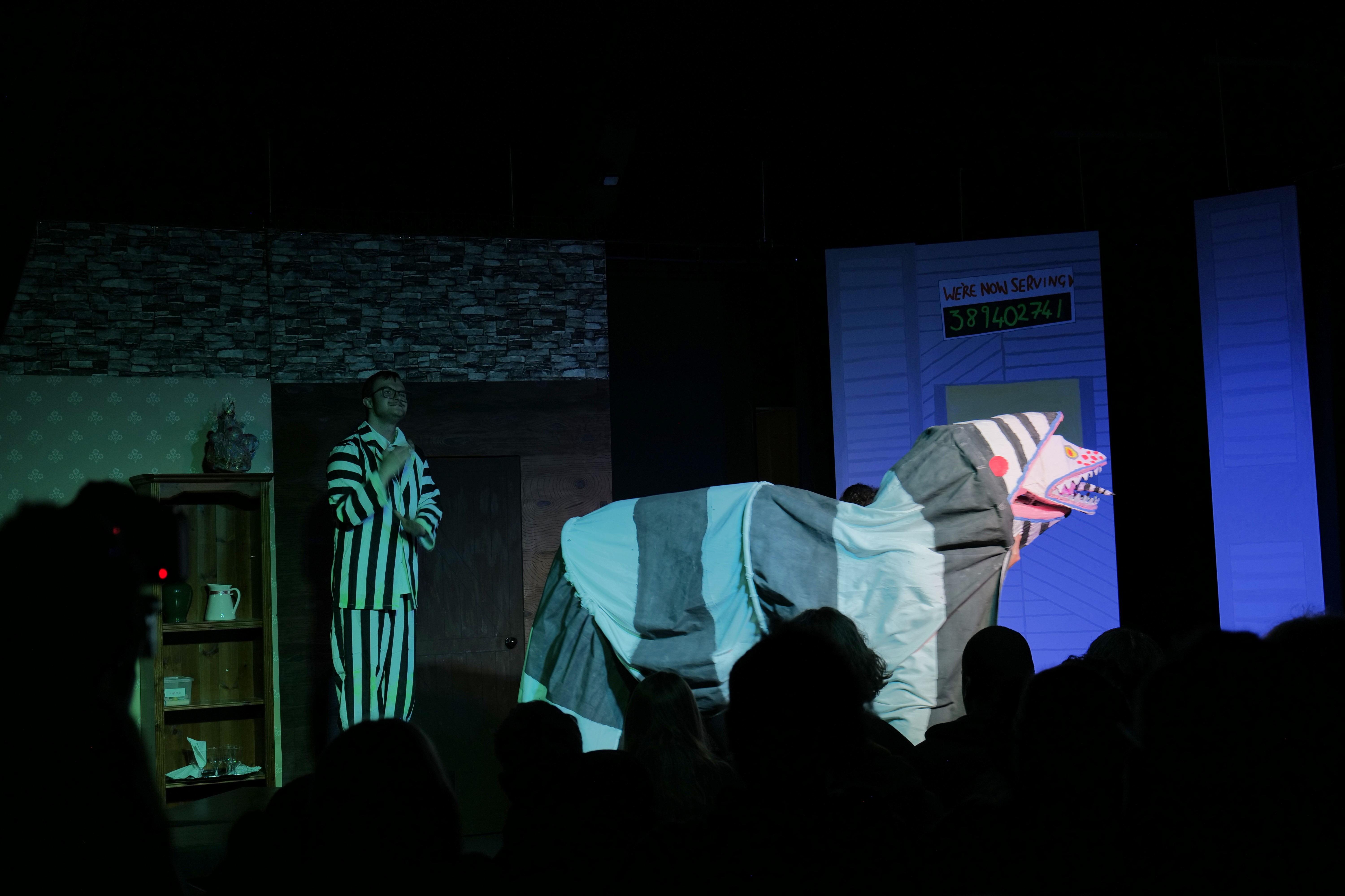 Image of a student dressed as Beetlejuice and a sandworm Image of a student dressed as Beetlejuice and a sandworm