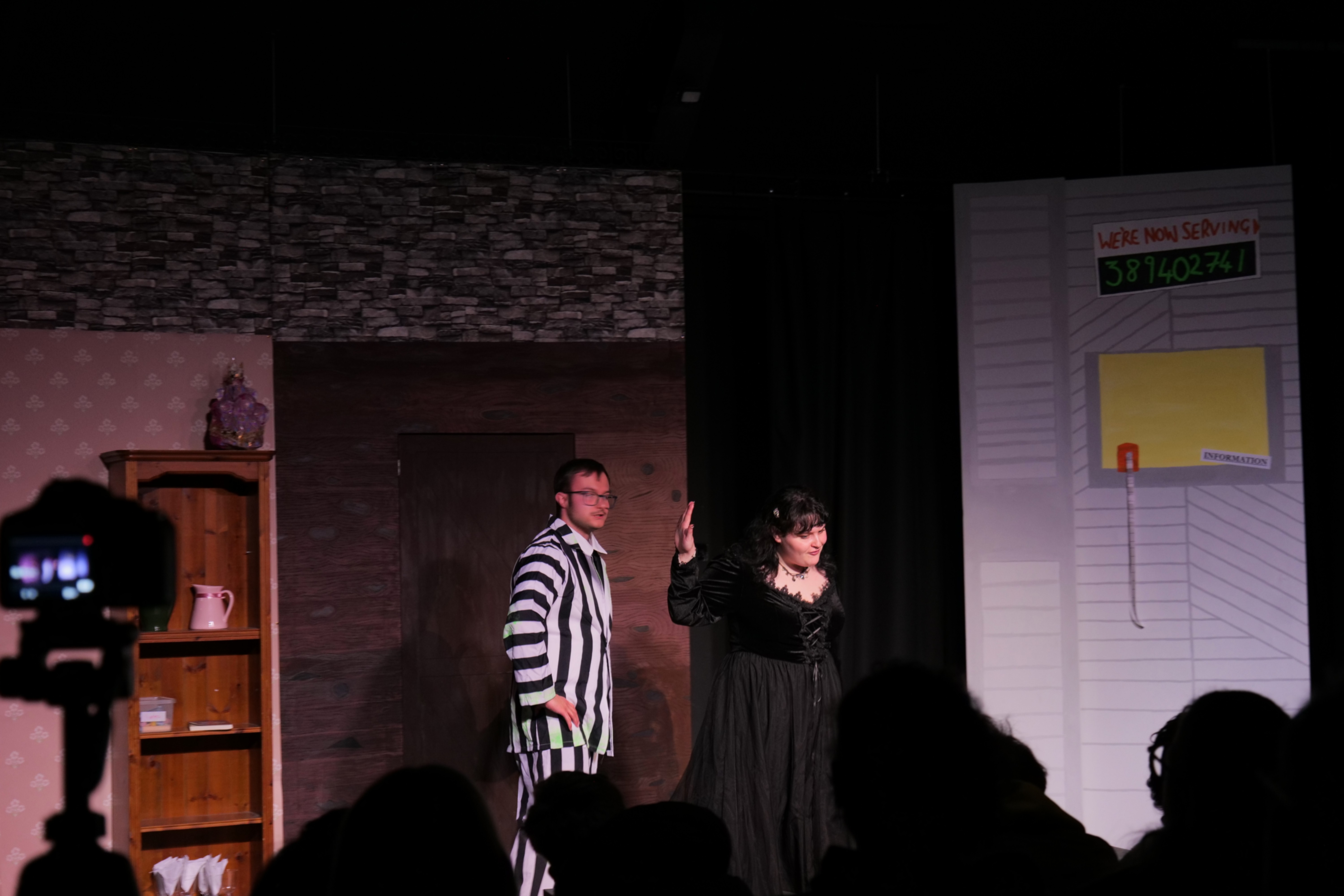 Students playing Lydia and Beetlejuice singing together Students playing Lydia and Beetlejuice singing together