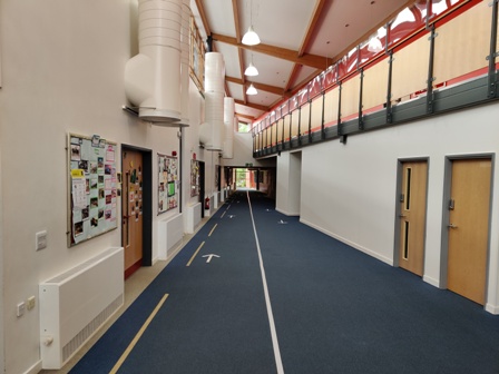 One way system arrows and tactile markings on the Bradbury Centre corridor floor 