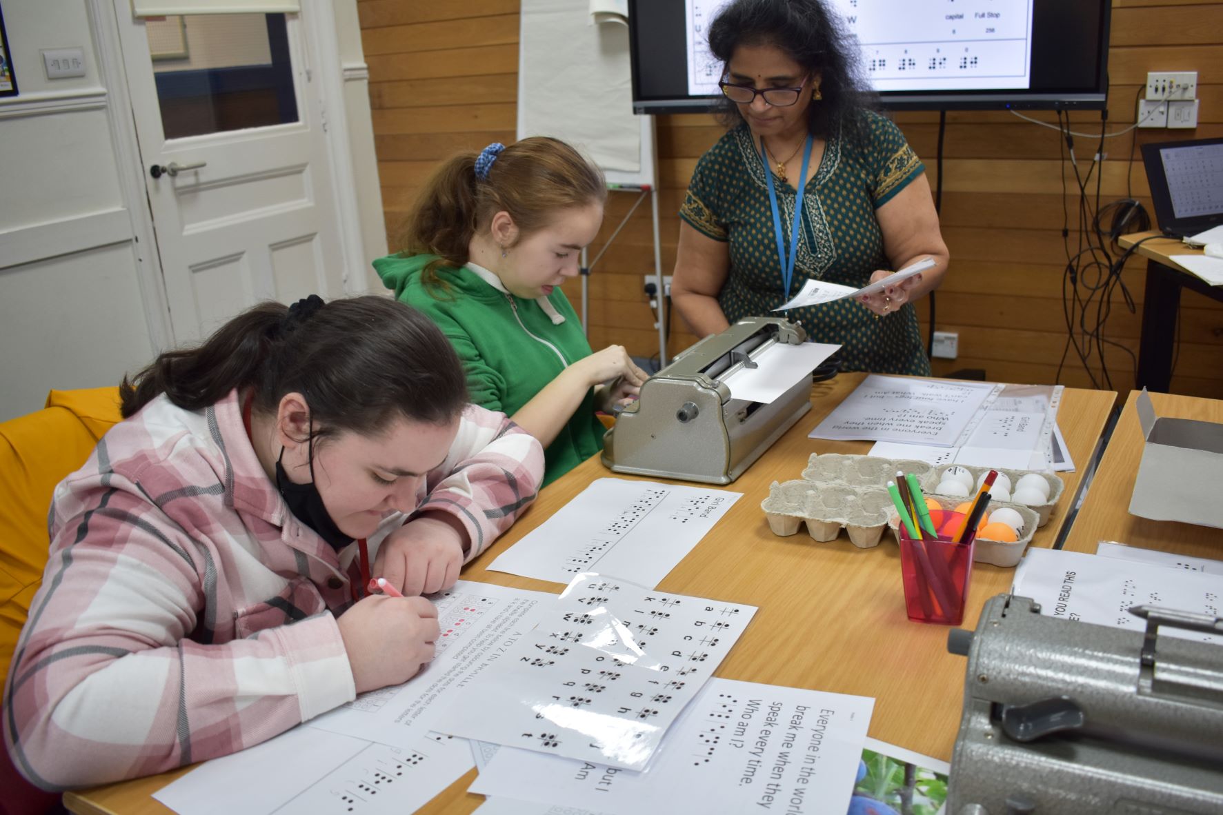 Students learning about Braille Students learning about Braille