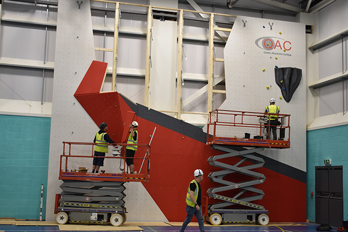 Picture showing the new climbing wall at QAC in the process of being built