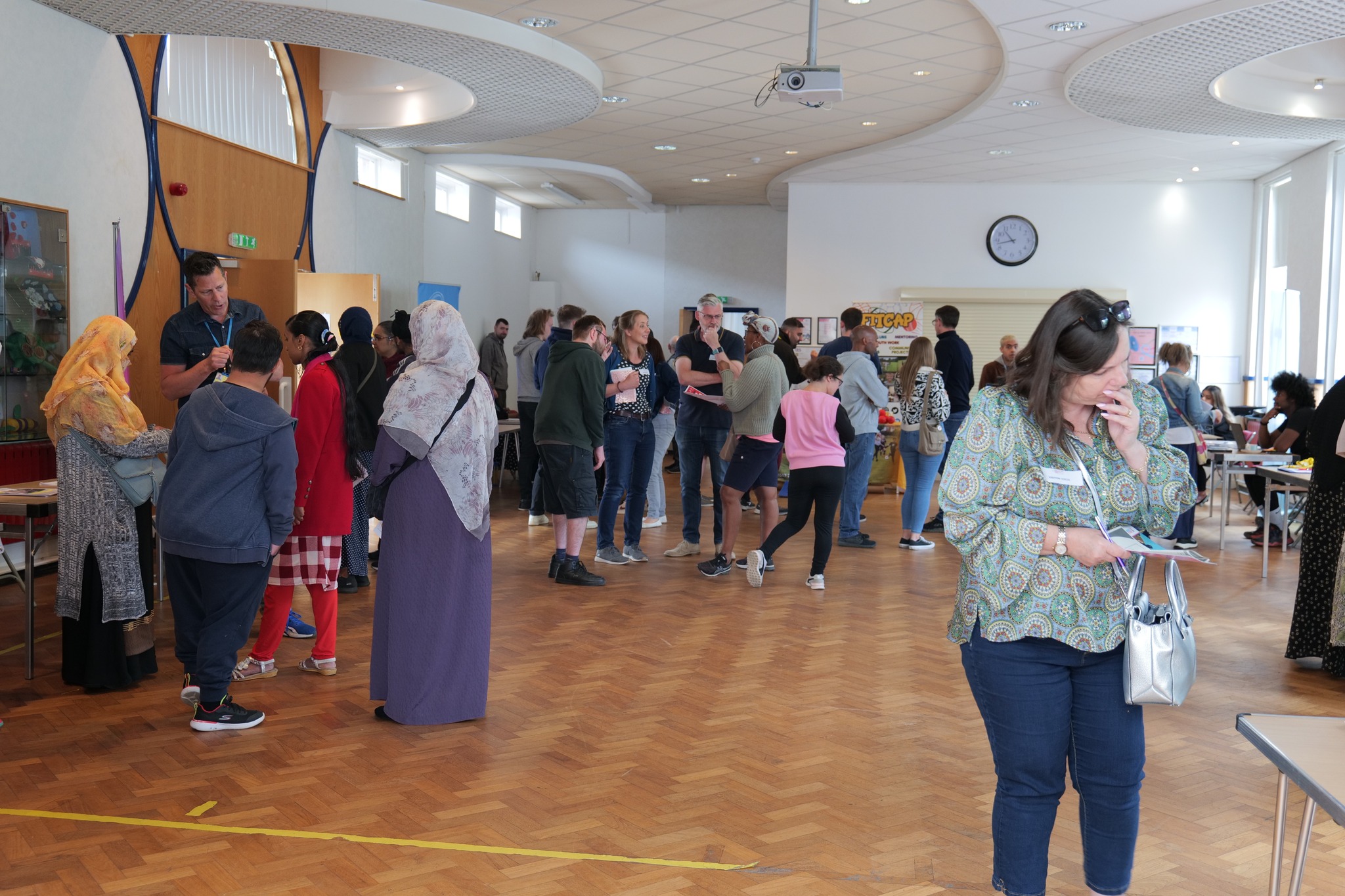 QAC Visitors talking to exhibitors