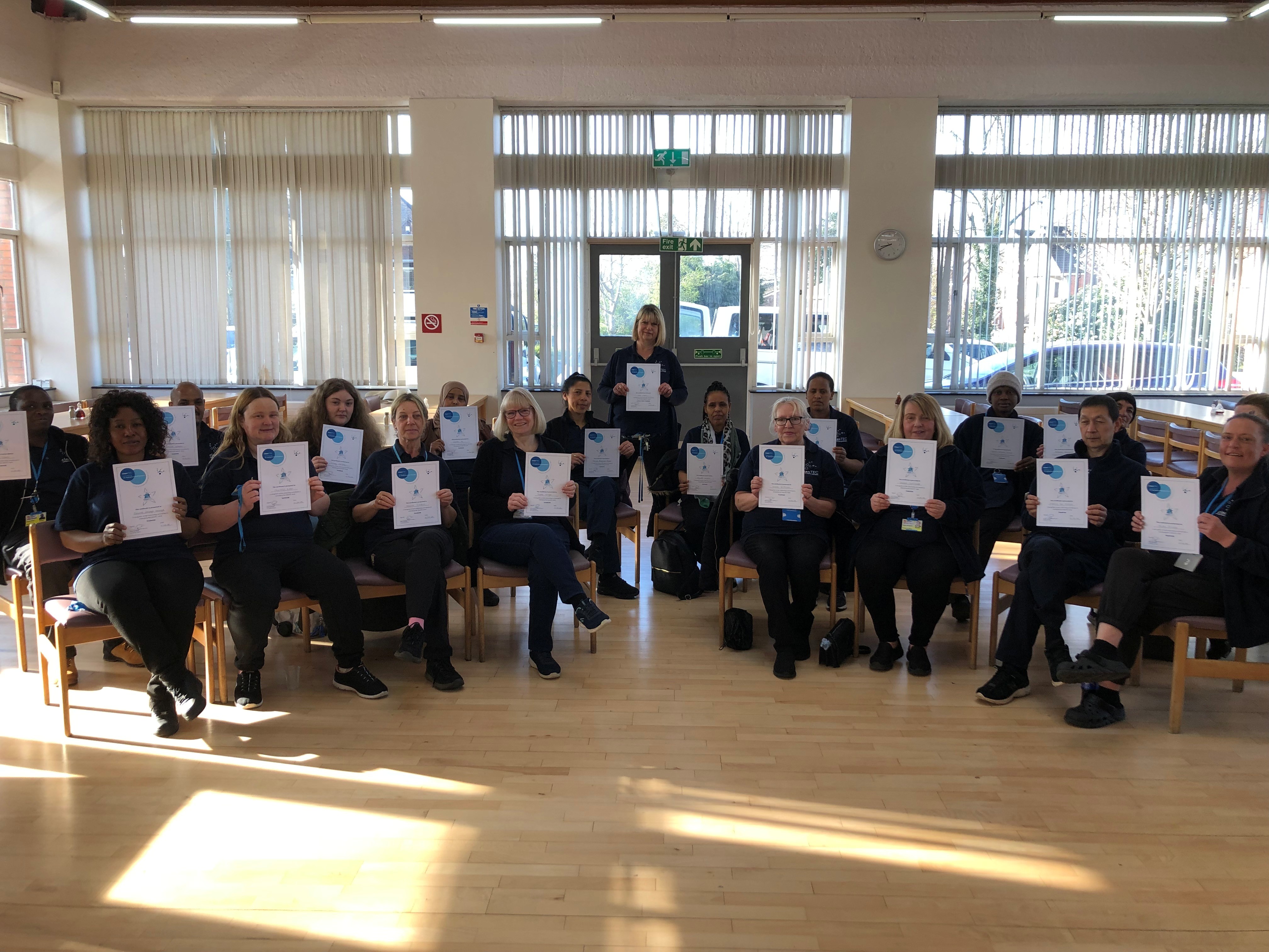 Image of CleanTEC staff smiling and holding their certificates