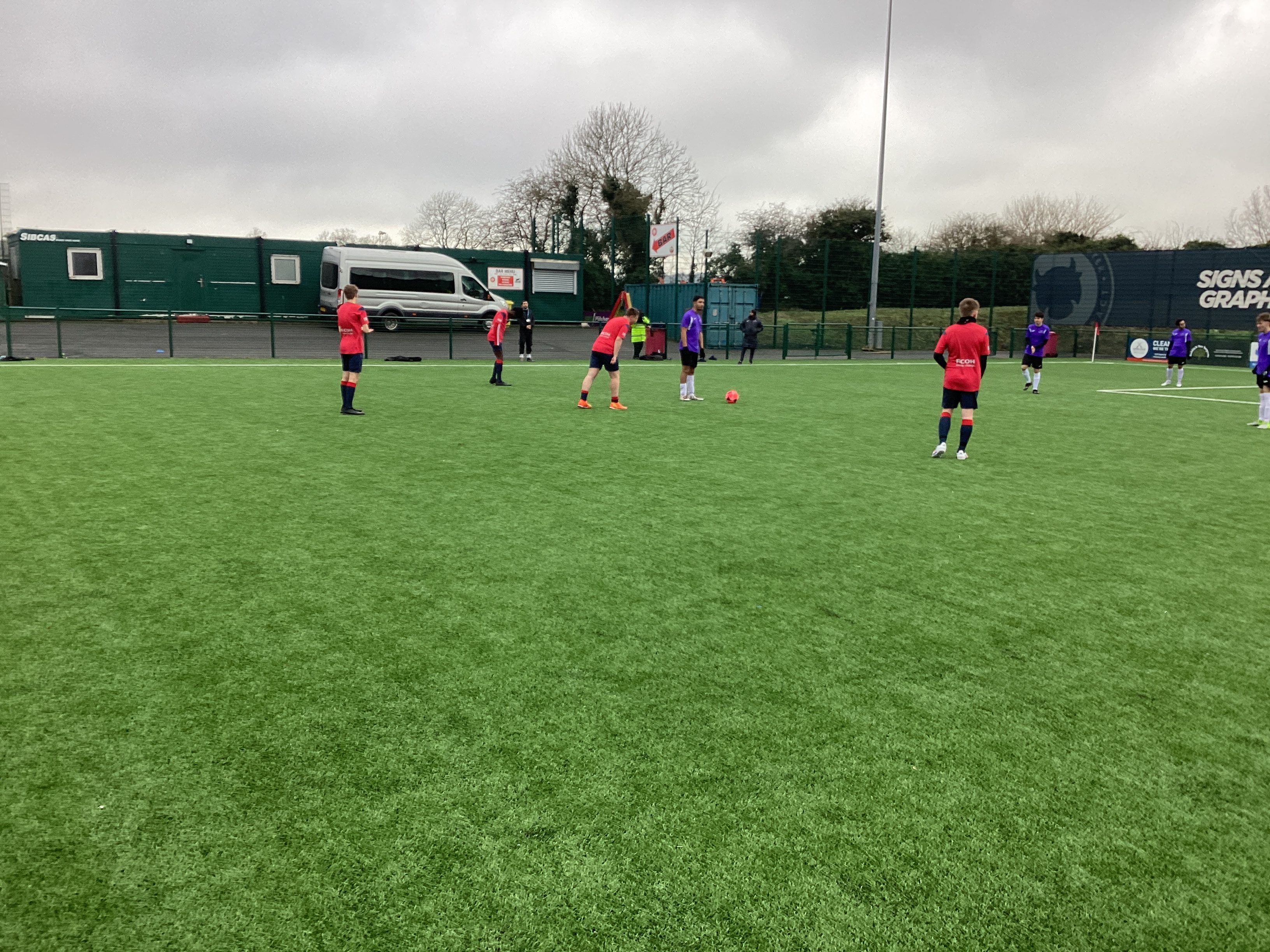 Students playing football on a green field /media/news/library/img_0078.jpg