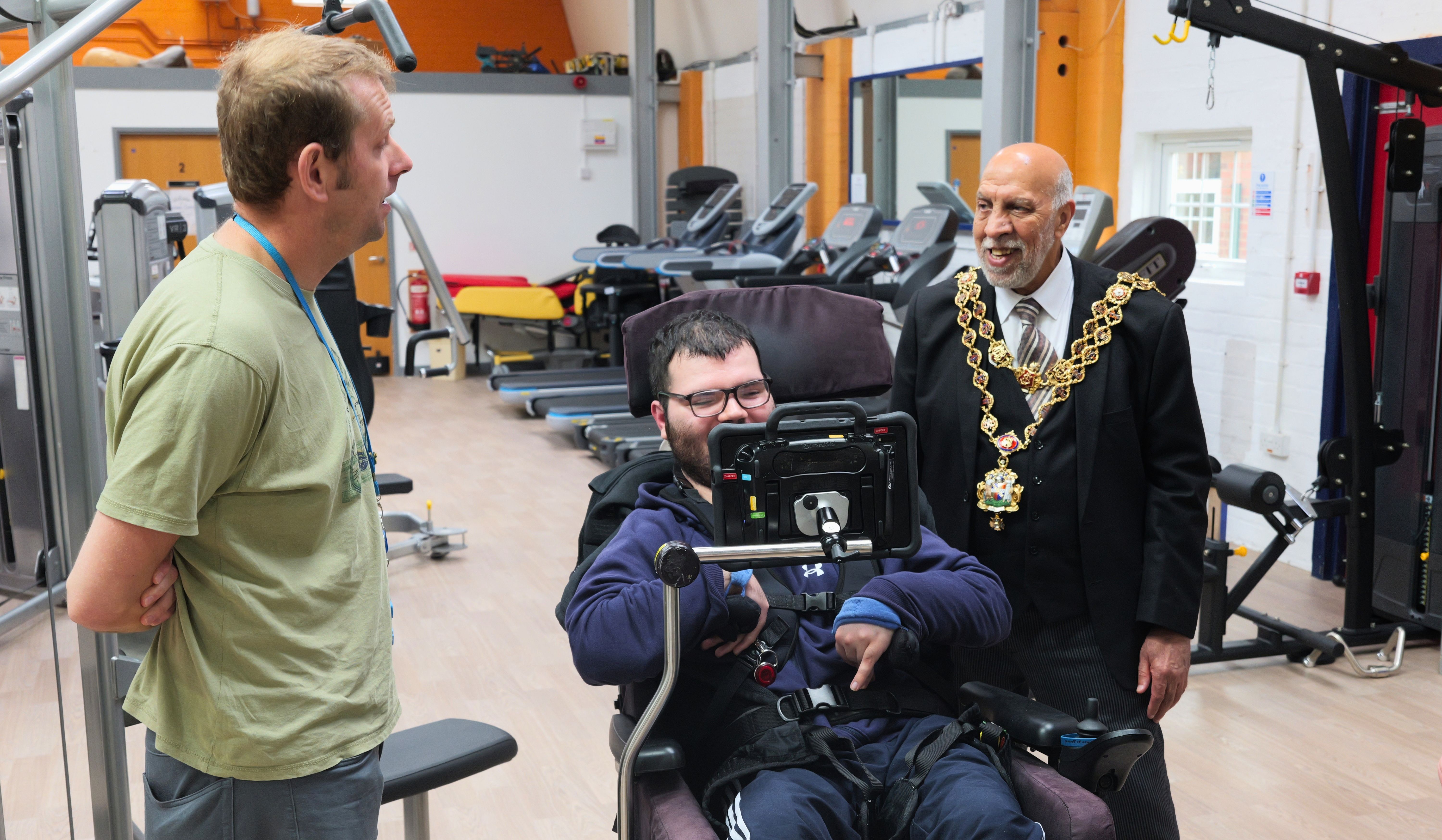 Lord Mayor in the gym with a staff member, including a wheelchair user Lord Mayor in the gym with a staff member, including a wheelchair user