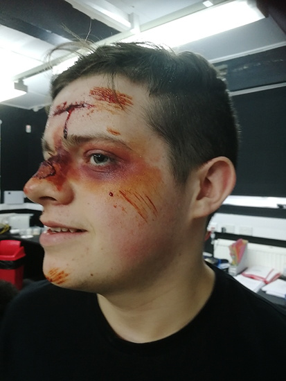 Performing Arts student with special effects makeup on his face