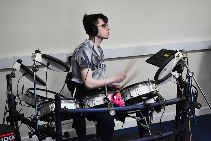 QAC student recording drums for the music piece QAC student recording drums for the music piece