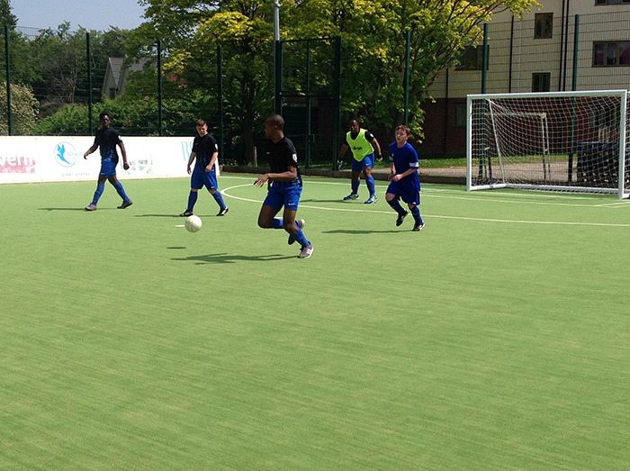 QAC football players during a match at the Natspec games
