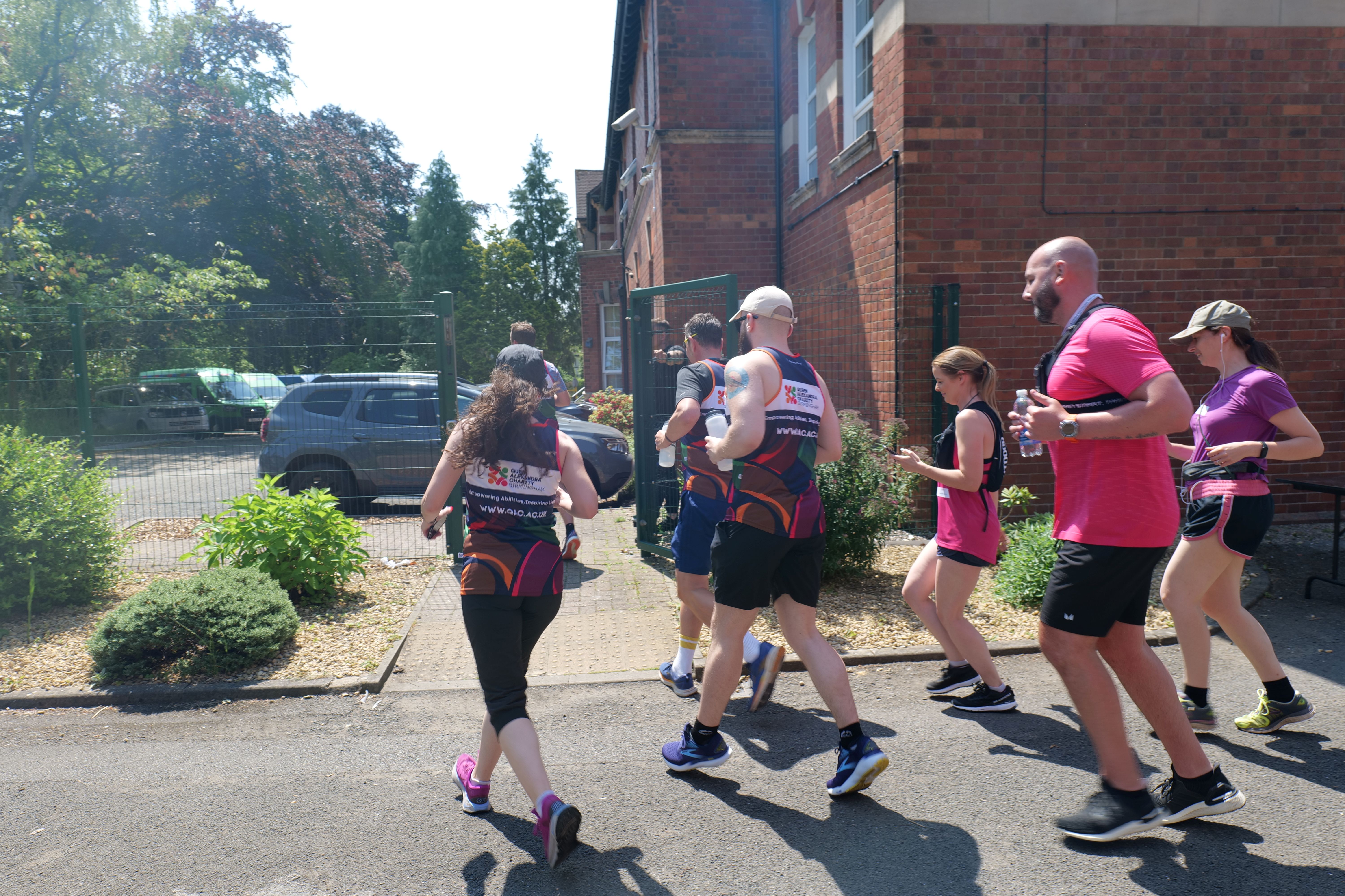 Image of the runners leaving the QAC campus