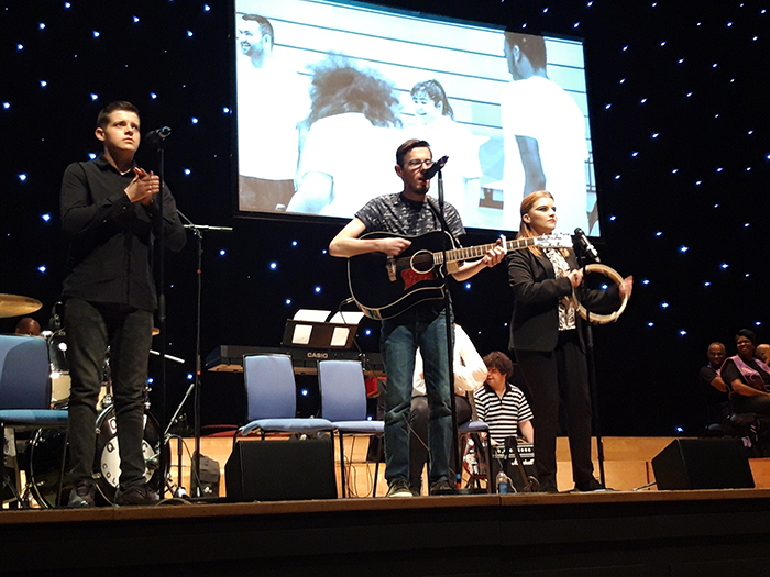 Members of the QAC Collective performing on stage at the Birmingham Town Hall Members of the QAC Collective performing on stage at the Birmingham Town Hall