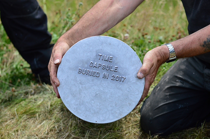 Close up shot of the side of the Time Capsule, which reads "Time Capsule buried in 2017"