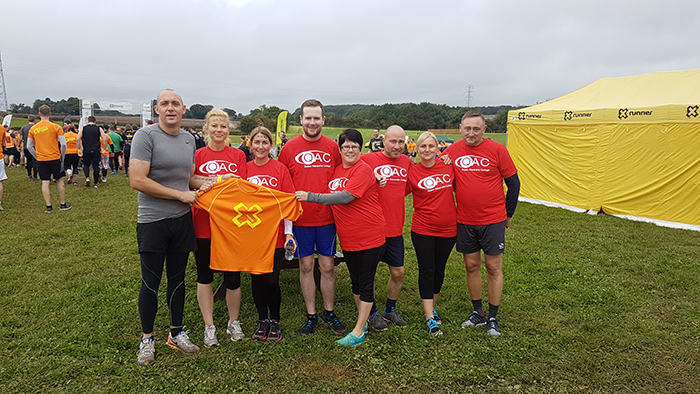 Team QAC Runners posing for photo before the race