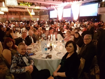 QAC staff sit around a table at the Tes FE Awards