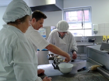 Steve Love making pasta with QAC students