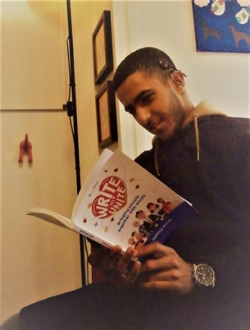QAC student Abdullah reading a book