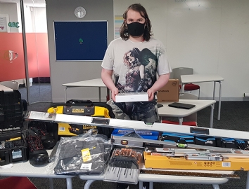 QAC Student Thomas pictured with his new tools!