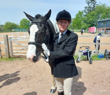 QAC student Sam and his horse Woody.