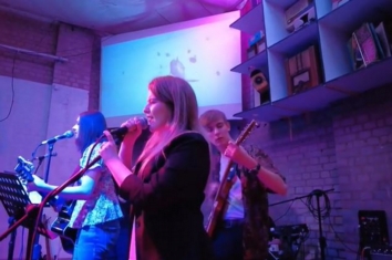 QAC Collective perform on stage