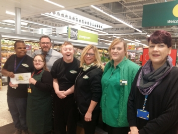 Students collect cheque from Morrisons Edgbaston