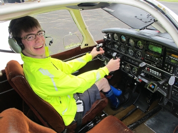 Bobby behind the controls of the plane