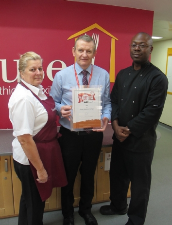 The OCS Foodhouse Team hold award