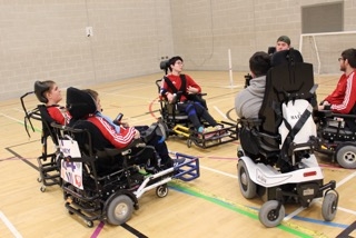 QAC's Powerchair Football team before a game