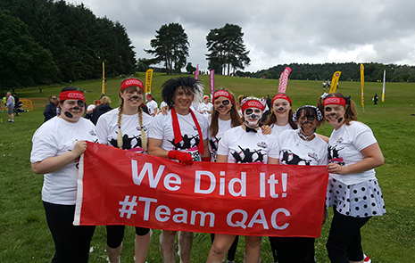 Group of runners after a successful fundraising run for QAC