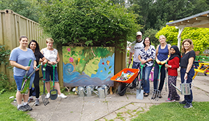 Volunteers supporting a fundraising event in support of QAC